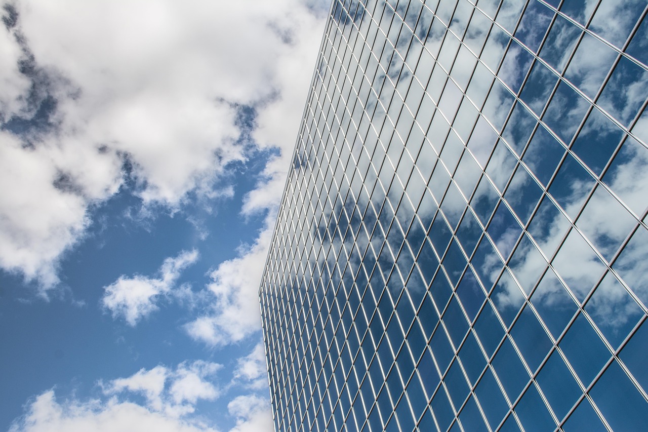 Building, reflection, clouds — "Exploring IronFX Through Customer Feedback and Experiences"