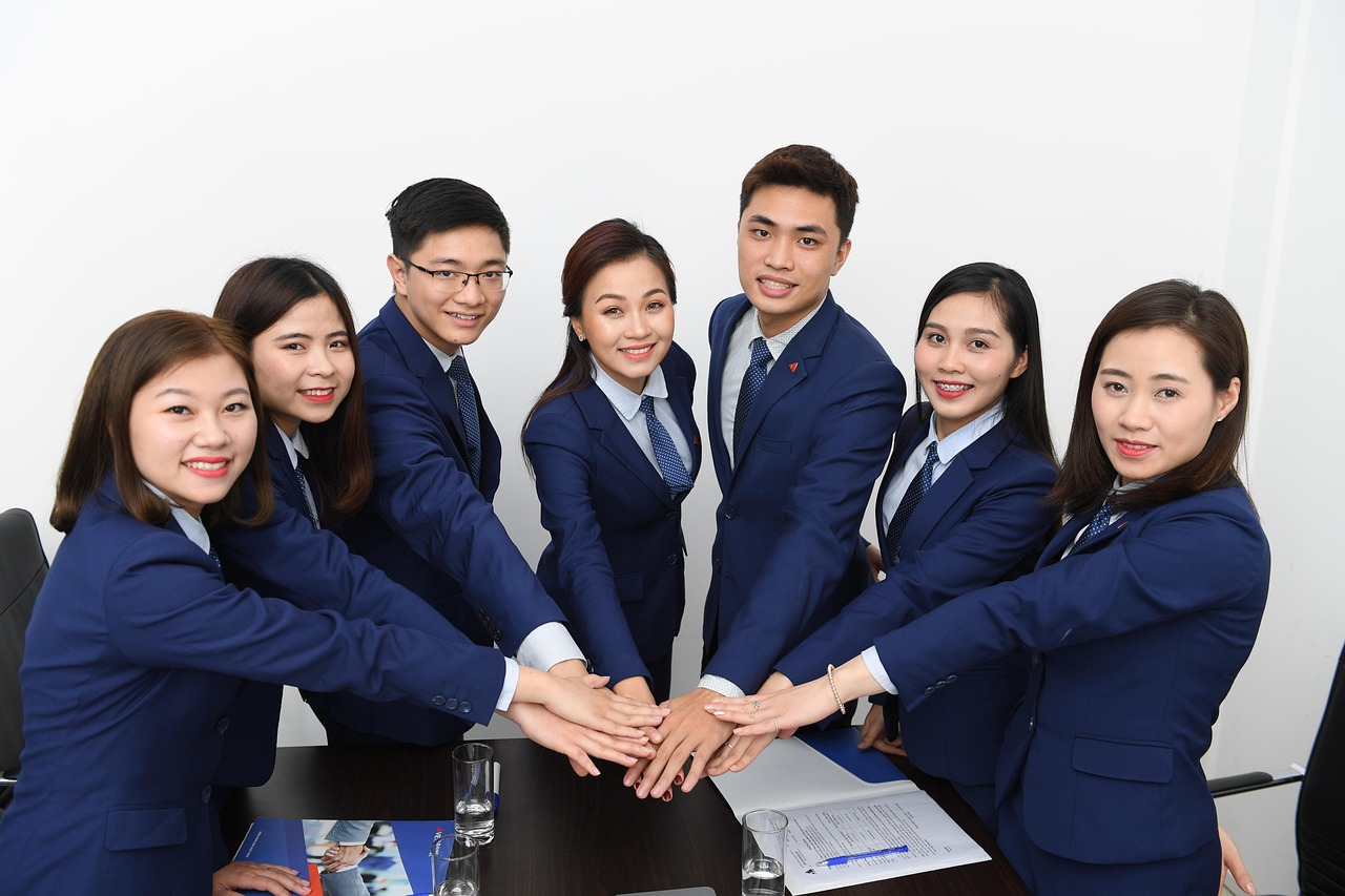 Team, business, asians — Transform Your Financial Future with Tailored Loans for Bad Credit